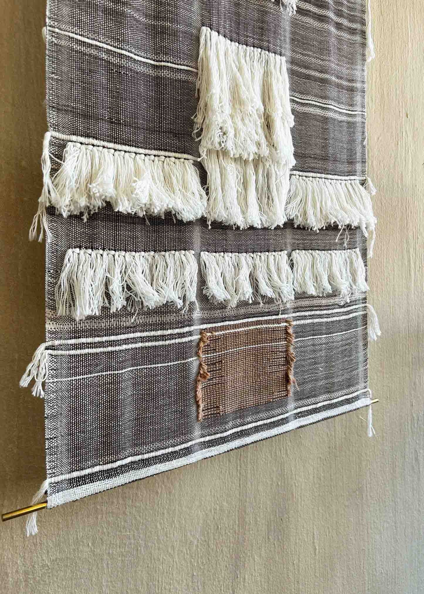 Scuro, an original artwork by Leila Walter woven using vintage & local cotton featuring fringe details