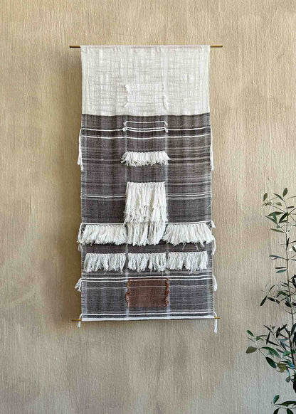 Scuro, an original artwork by Leila Walter woven using vintage & local cotton featuring fringe details