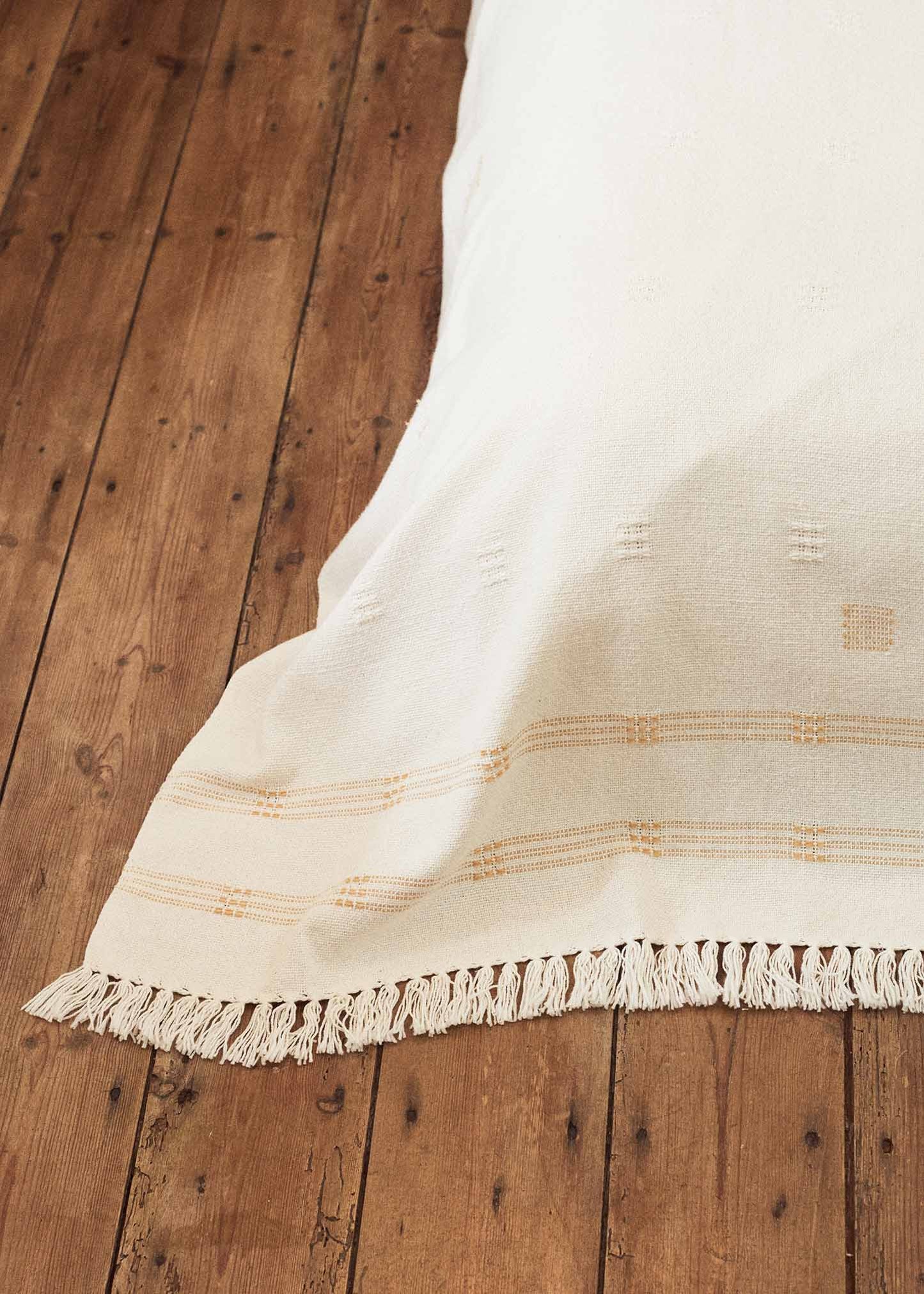 The Spine Blanket, our luxurious handwoven & hand stitched local, natural cotton blanket